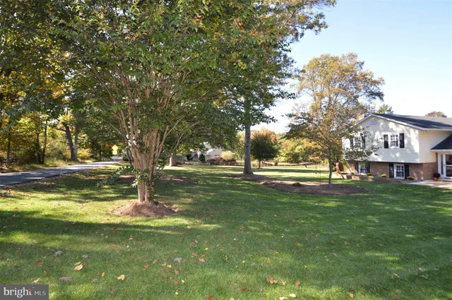 a view of a golf course with a lake view