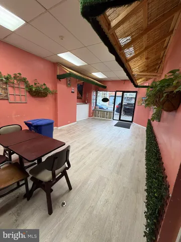 a balcony with chairs and wooden fence