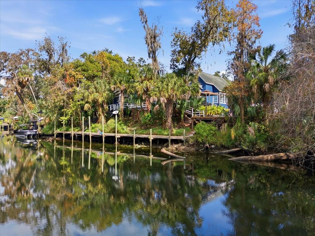4703 Rambling River Road Brandon, FL 33511 - Photo 2 of 2 a view of a lake with a building in front of it