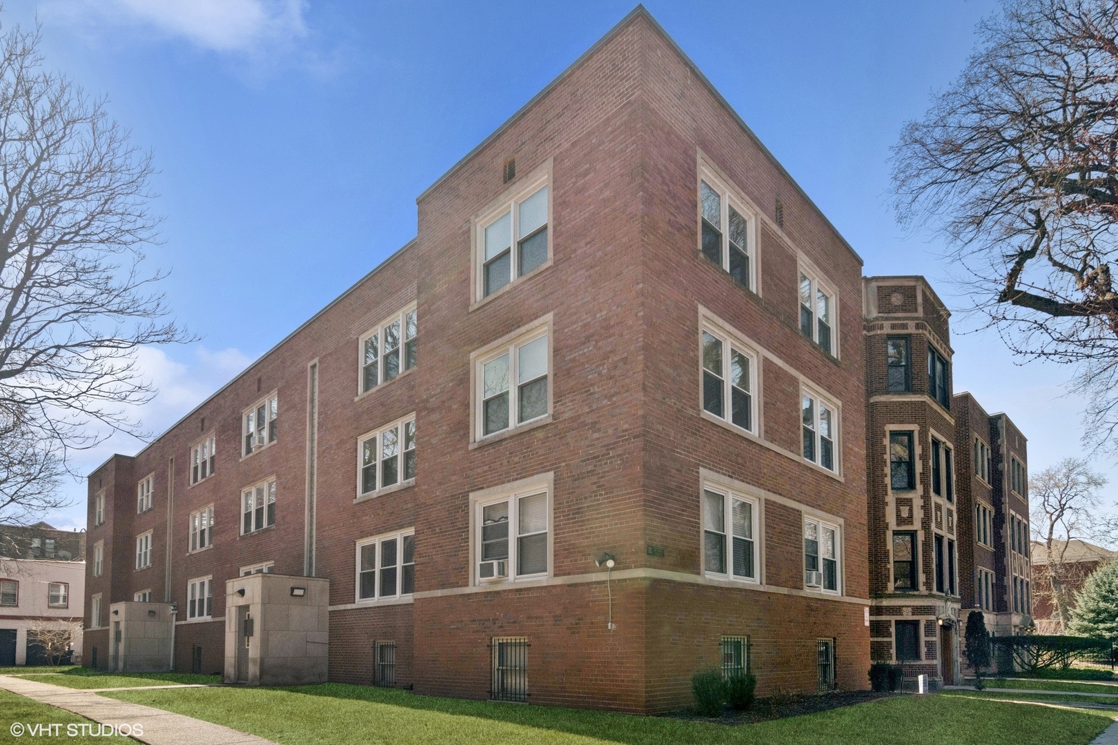 a view of a building with a yard
