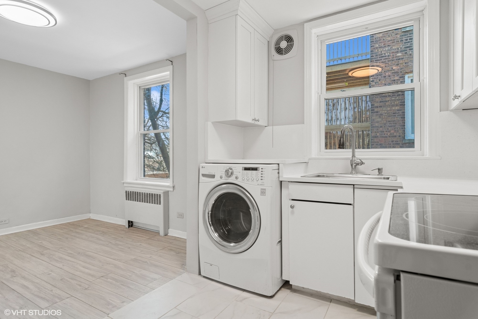 1143 East 50th Street, Unit 2 Chicago, IL 60615 - Photo 13 of 29 a utility room with sink dryer and washer