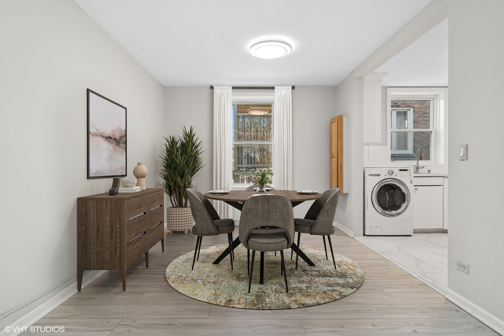 1143 East 50th Street, Unit 2 Chicago, IL 60615 - Photo 14 of 29 a living room with furniture a dining table and a fireplace