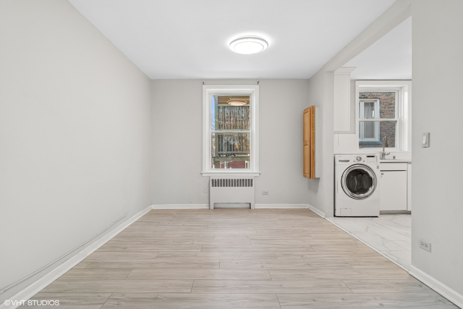 1143 East 50th Street, Unit 2 Chicago, IL 60615 - Photo 15 of 29 a view of a kitchen with a sink a washer and dryer