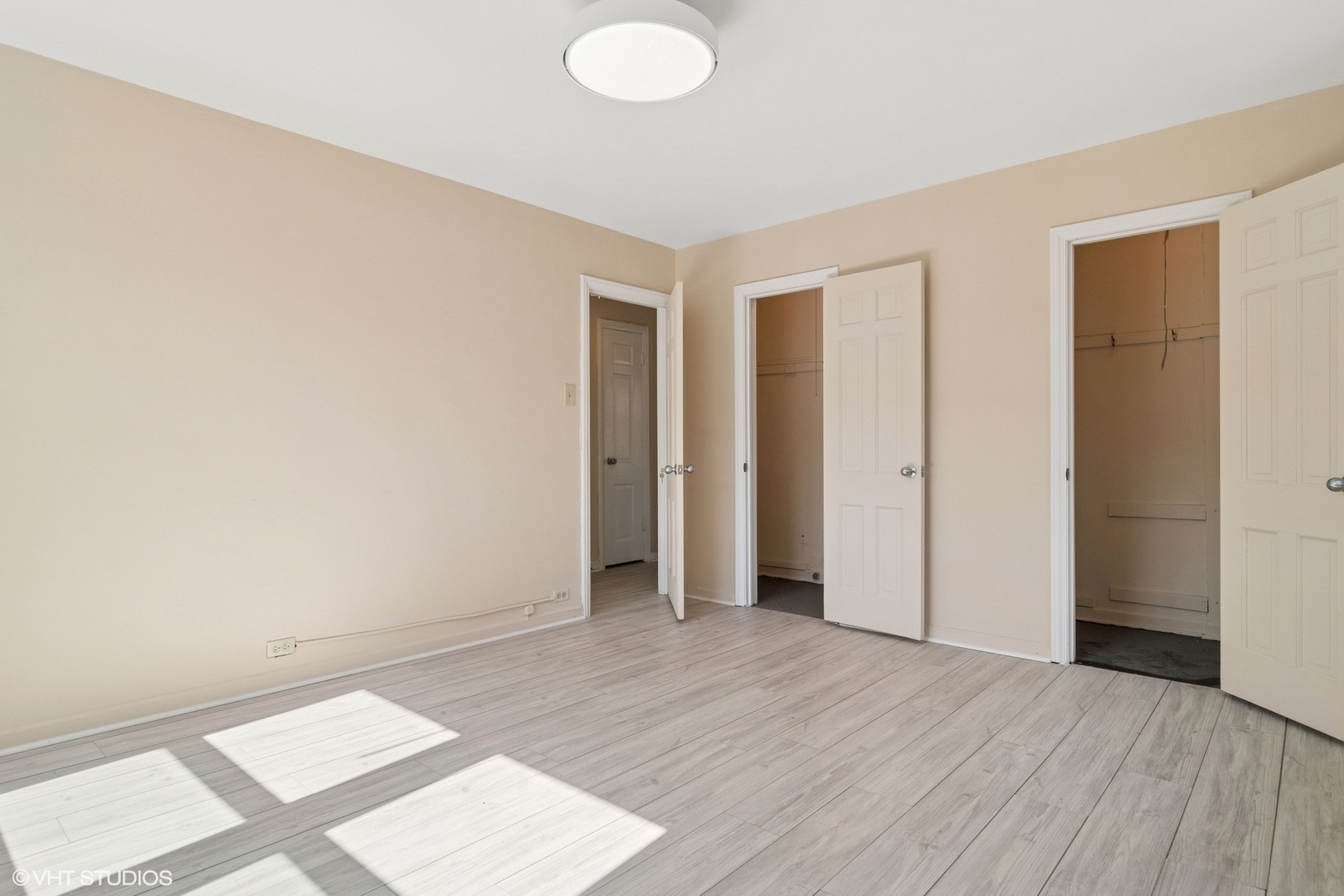 1143 East 50th Street, Unit 2 Chicago, IL 60615 - Photo 26 of 29 an empty room with wooden floor and windows