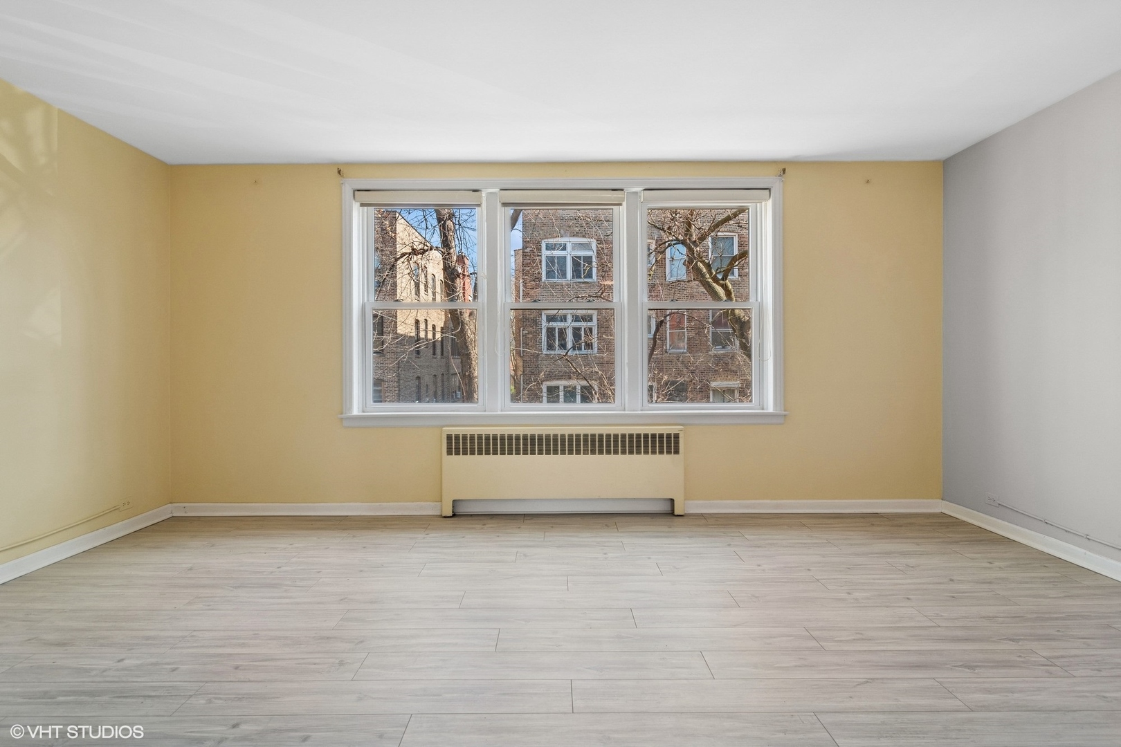 1143 East 50th Street, Unit 2 Chicago, IL 60615 - Photo 3 of 29 a view of an empty room with a window