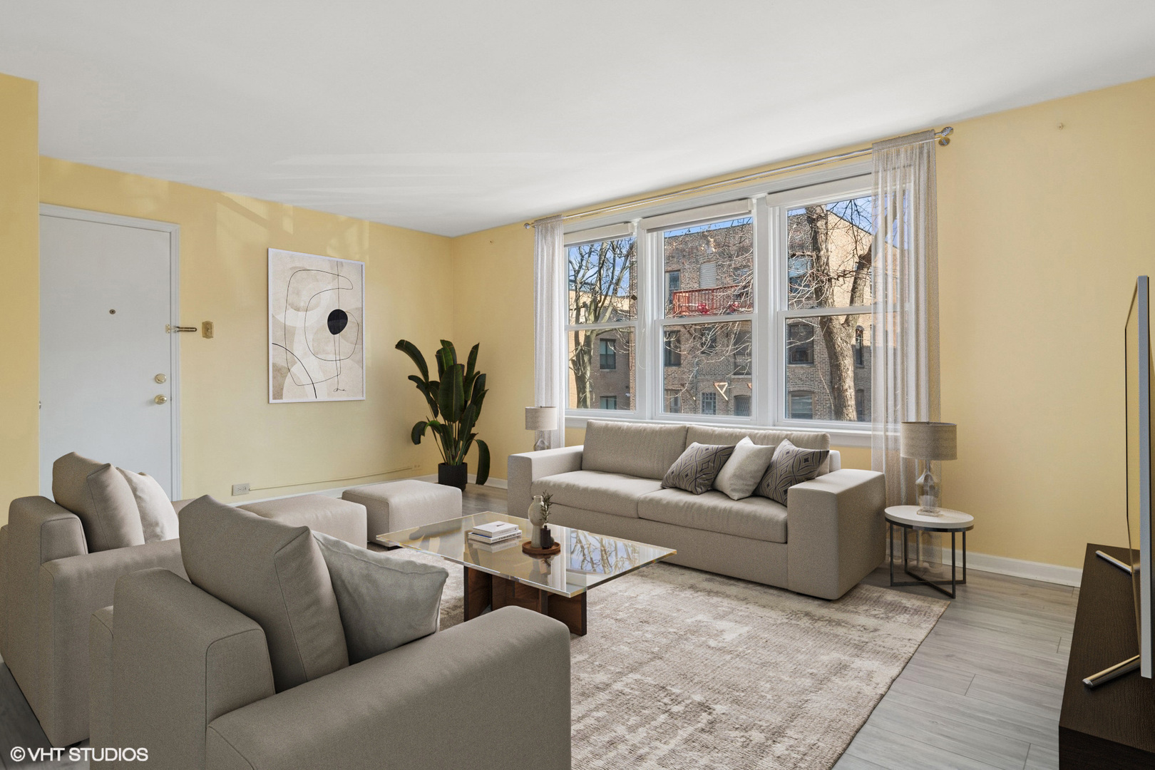 1143 East 50th Street, Unit 2 Chicago, IL 60615 - Photo 4 of 29 a living room with furniture and a large window
