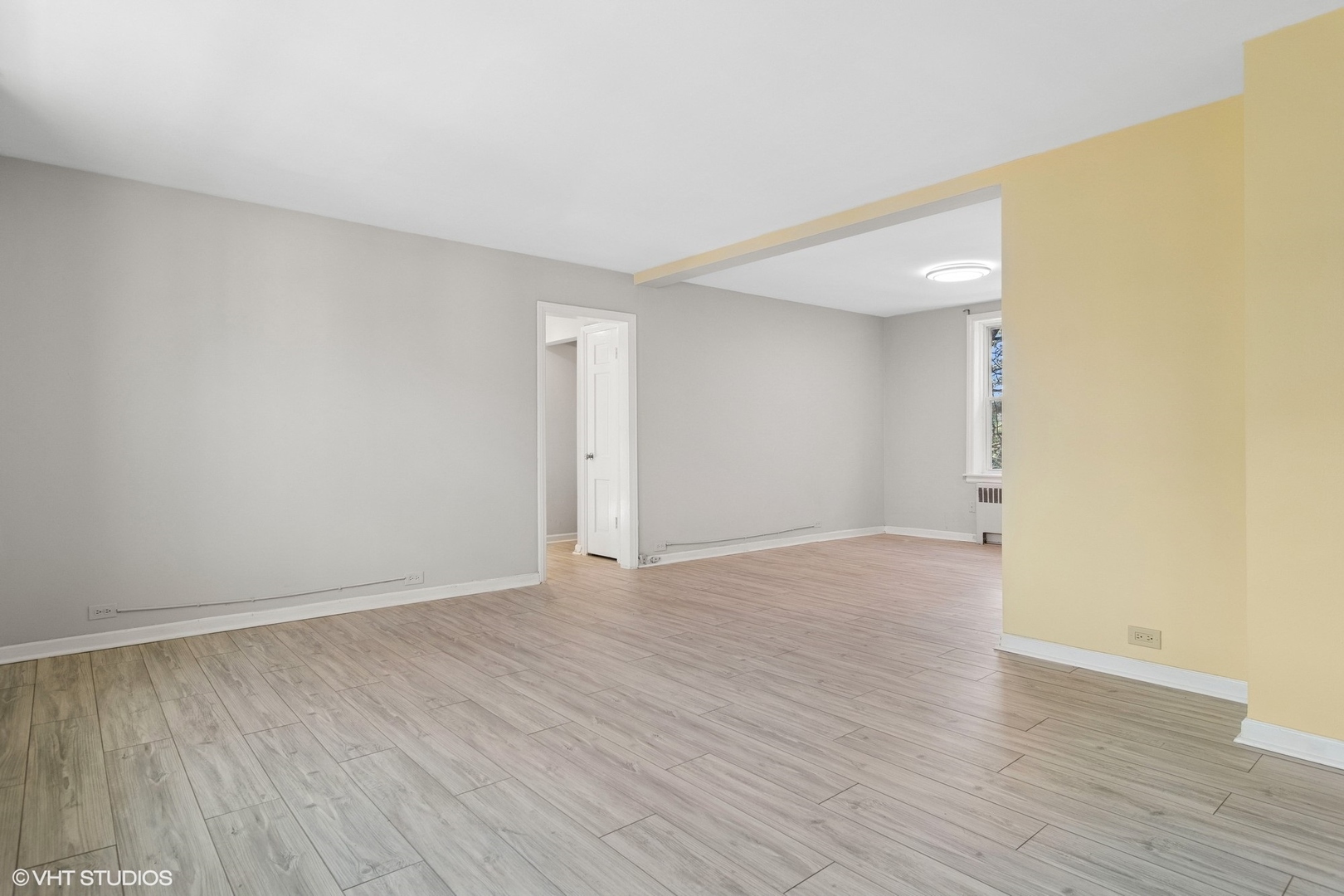 1143 East 50th Street, Unit 2 Chicago, IL 60615 - Photo 9 of 29 a view of an empty room with wooden floor