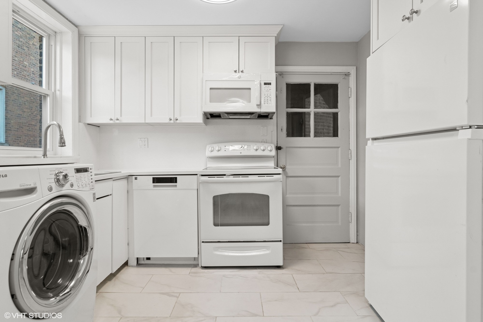 1143 East 50th Street, Unit 2 Chicago, IL 60615 - Photo 10 of 29 a kitchen with cabinets and a stove top oven