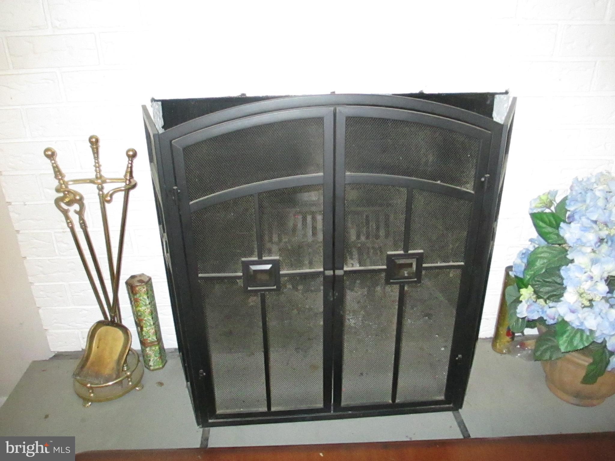 216 Locknell Road Lutherville-Timonium, MD 21093 - Photo 24 of 26 Basement fireplace