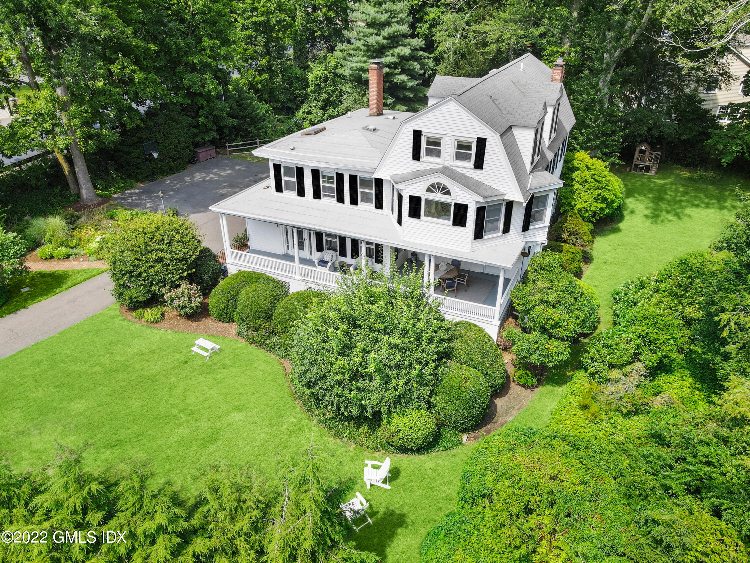 123 Riverside Avenue Riverside, CT 06878 - Photo 1 of 23 a aerial view of a house with big yard plants and large trees