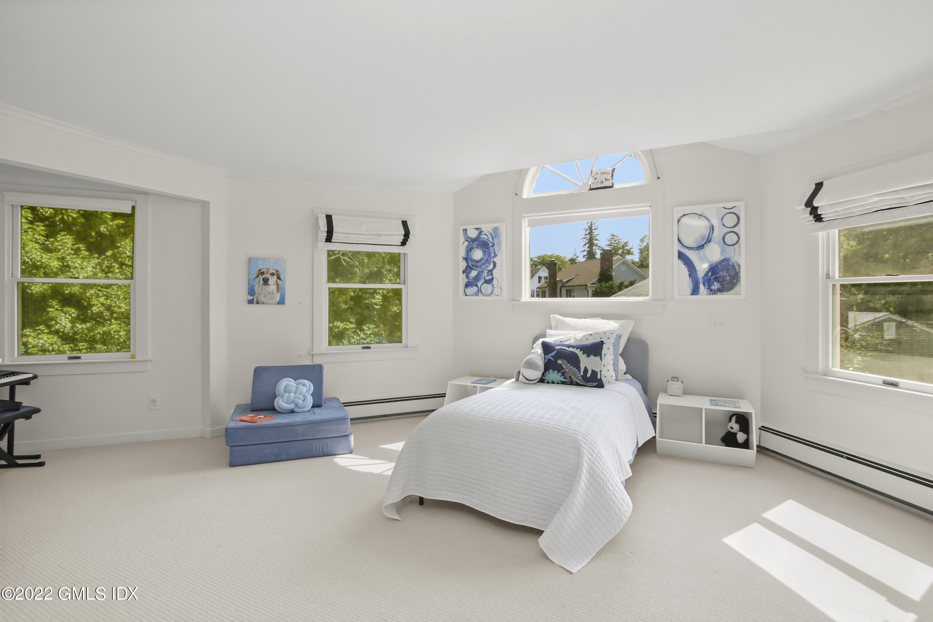 123 Riverside Avenue Riverside, CT 06878 - Photo 12 of 23 a bedroom with a bed and a window