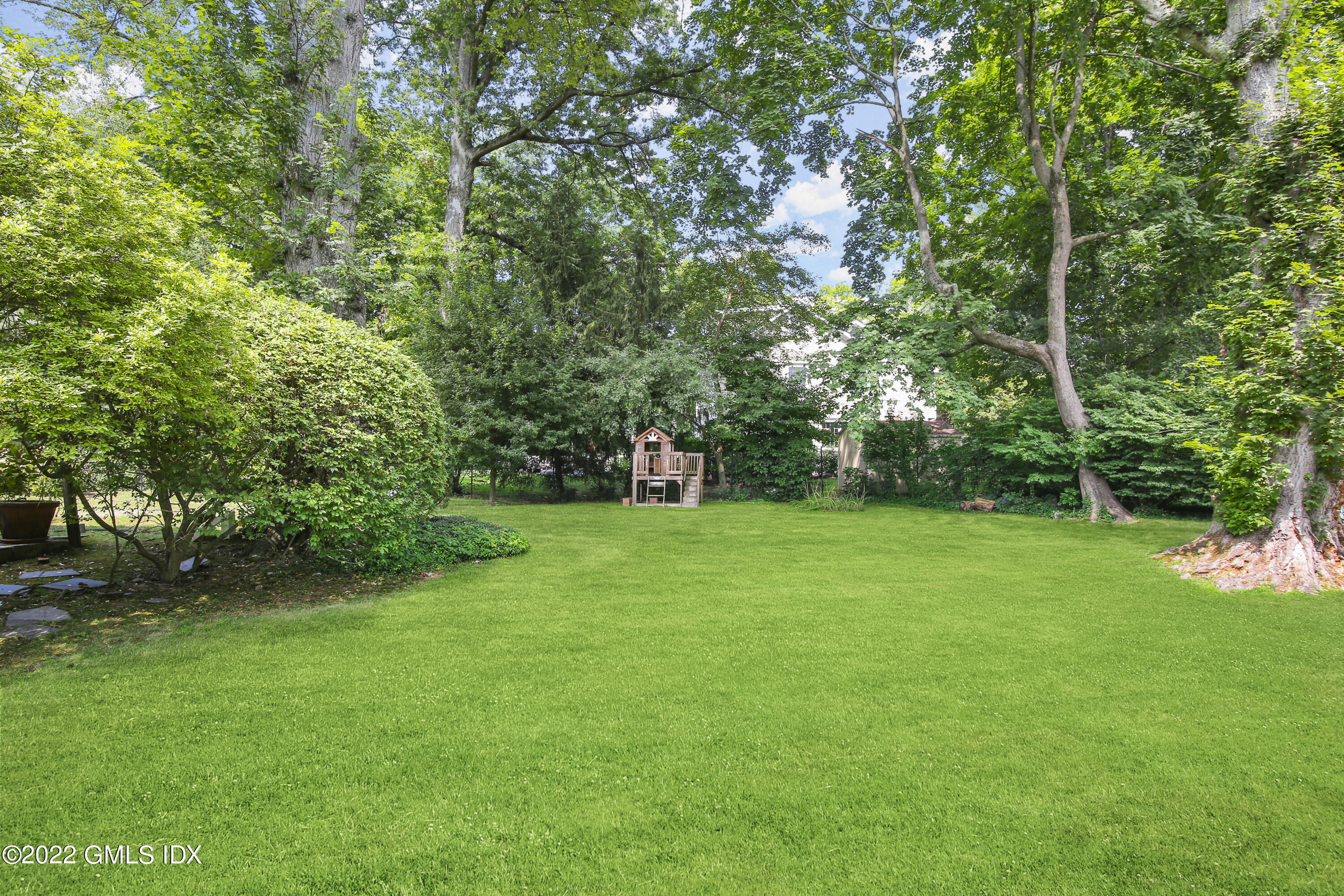 123 Riverside Avenue Riverside, CT 06878 - Photo 16 of 23 a view of a garden with a tree