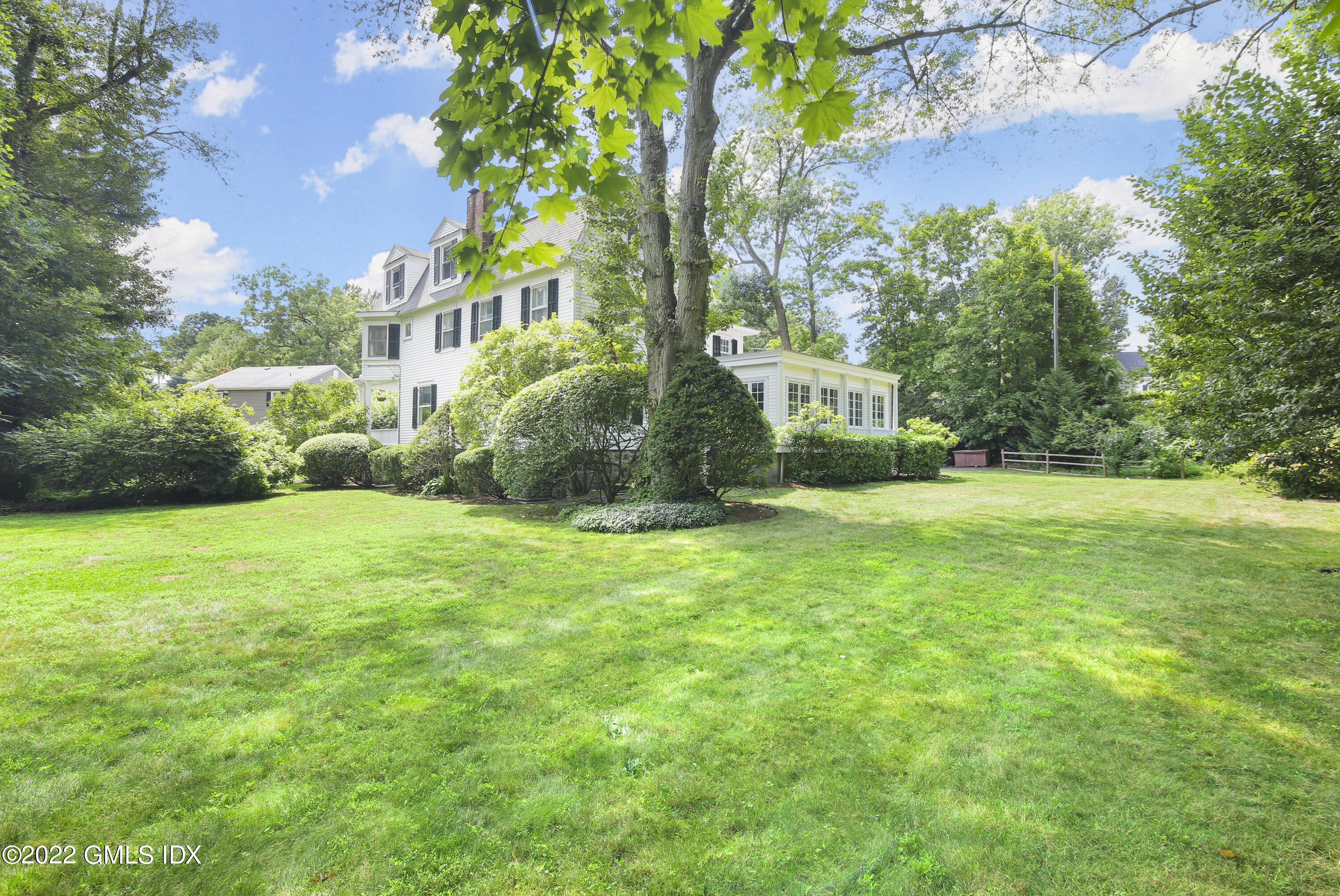 123 Riverside Avenue Riverside, CT 06878 - Photo 18 of 23 a view of a house with a garden
