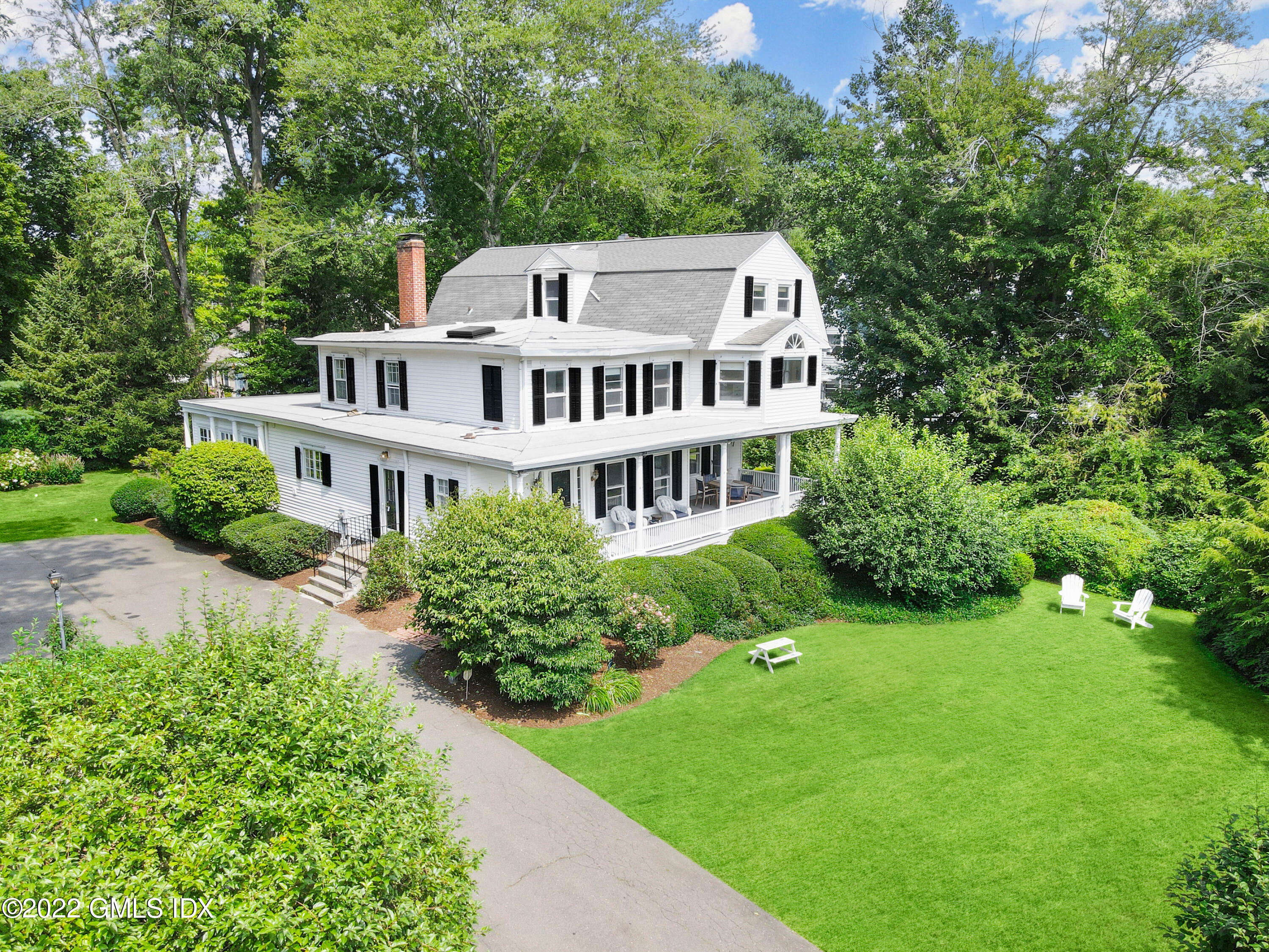 123 Riverside Avenue Riverside, CT 06878 - Photo 19 of 23 a view of a house with a yard and sitting area