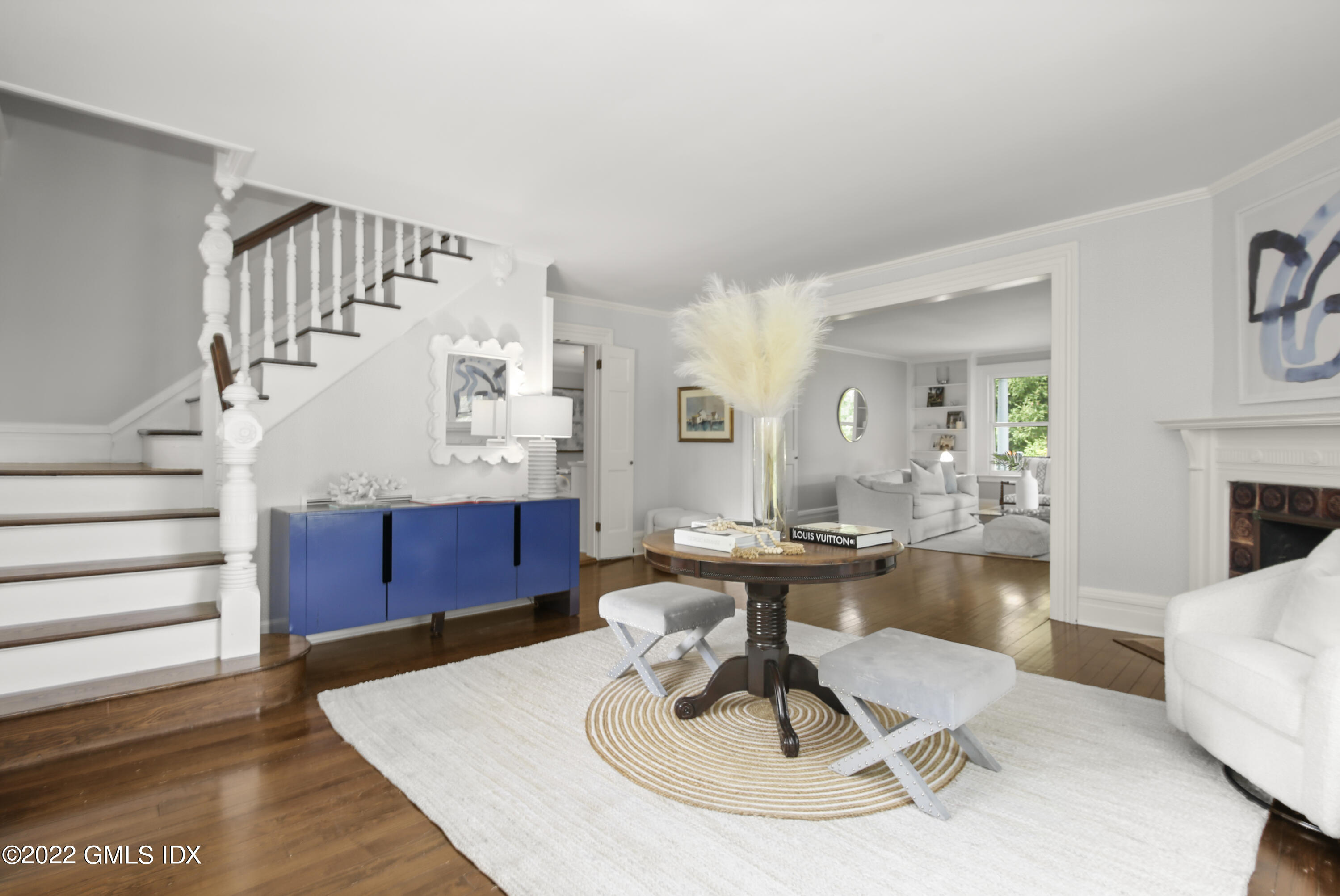 123 Riverside Avenue Riverside, CT 06878 - Photo 2 of 23 a living room with furniture and a chandelier