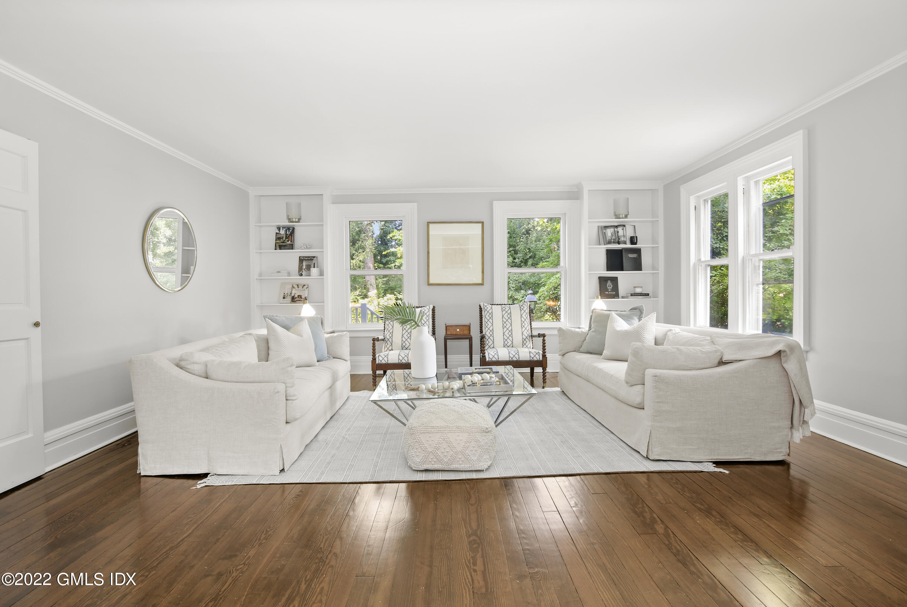 123 Riverside Avenue Riverside, CT 06878 - Photo 3 of 23 a living room with couches and a large window with outer view