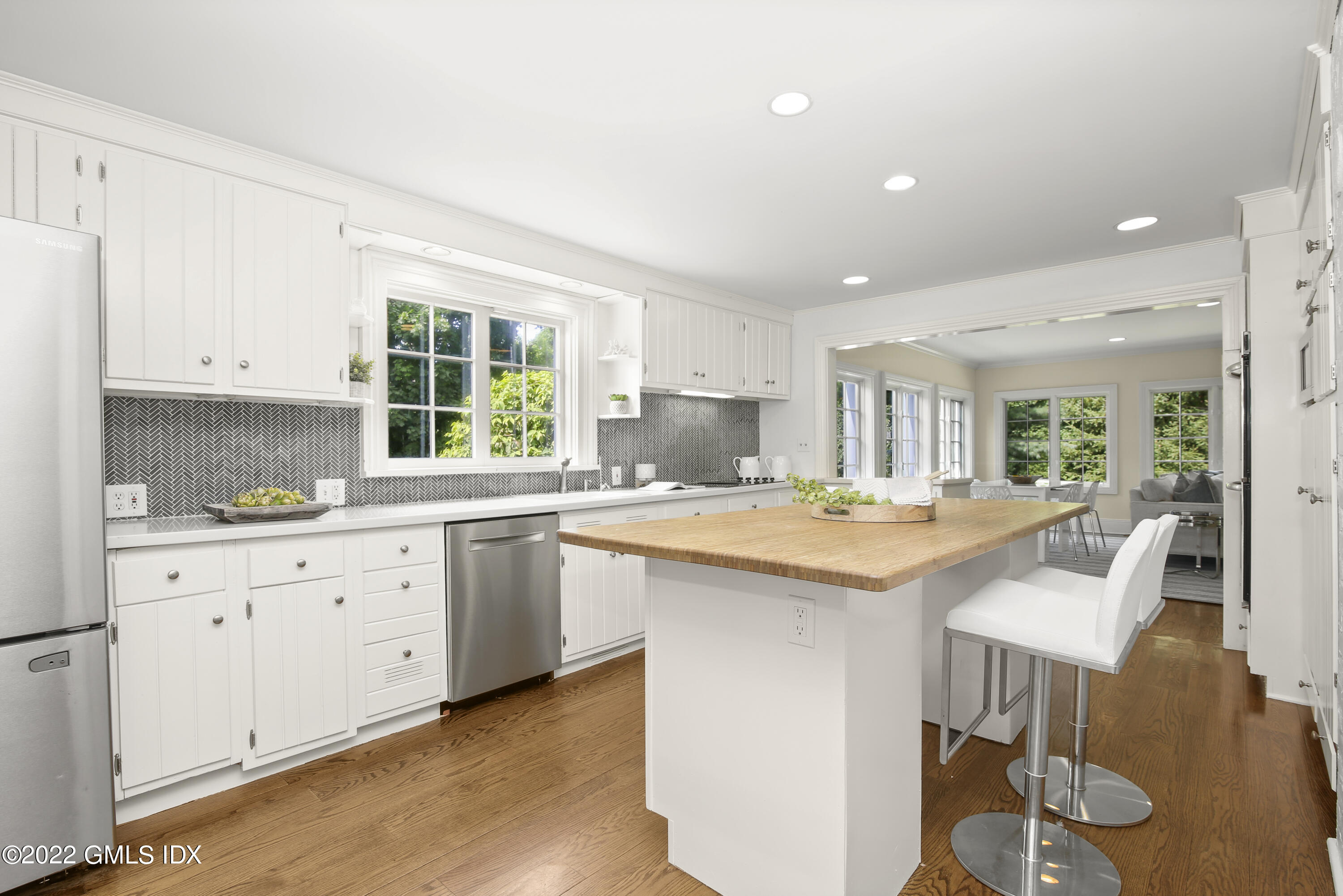 123 Riverside Avenue Riverside, CT 06878 - Photo 6 of 23 a kitchen with granite countertop white cabinets and white appliances