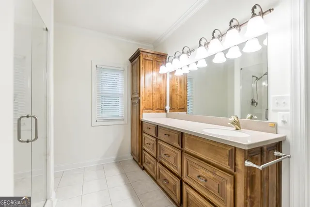 a bathroom with a sink double vanity and a mirror