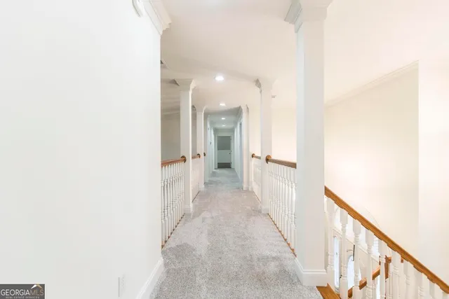 a view of a hallway with a white walls