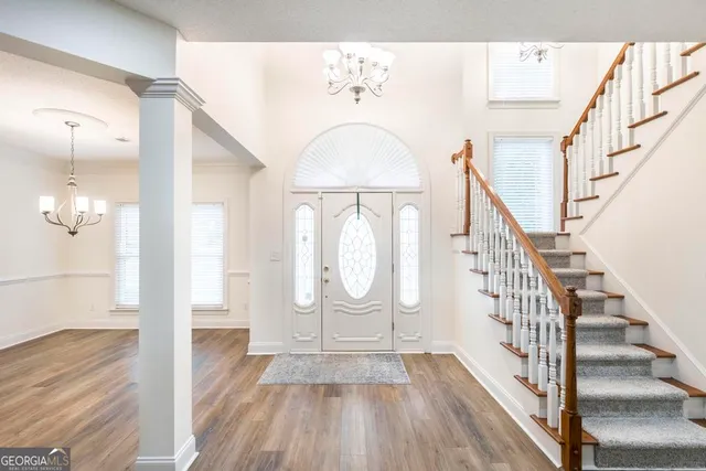 a view of entryway with wooden floor