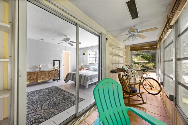 a view of a livingroom with furniture and a table