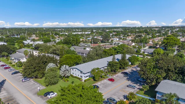an aerial view of residential houses with city view