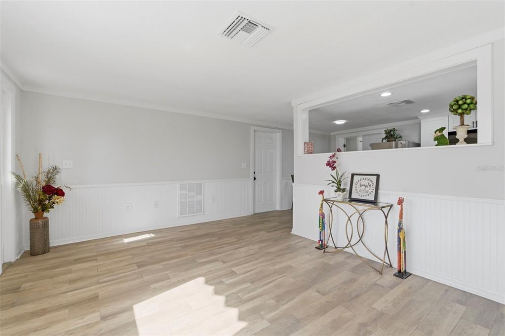 9033 Pegasus Avenue Port Richey, FL 34668 - Photo 7 of 56 wooden floor with white walls and white walls
