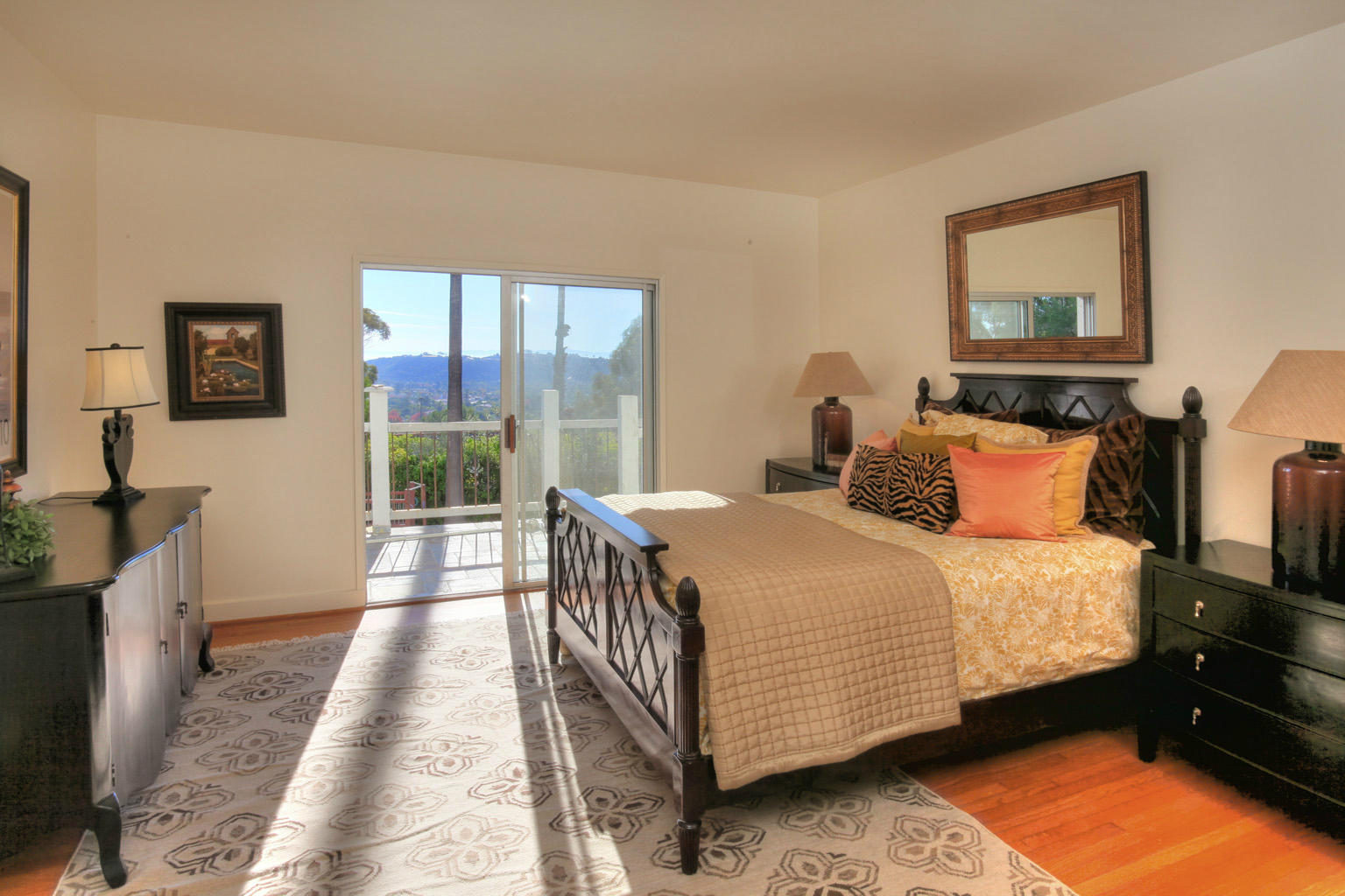 2135 Ridge Lane Santa Barbara, CA 93103 - Photo 7 of 15 a bedroom with a bed and wooden floor
