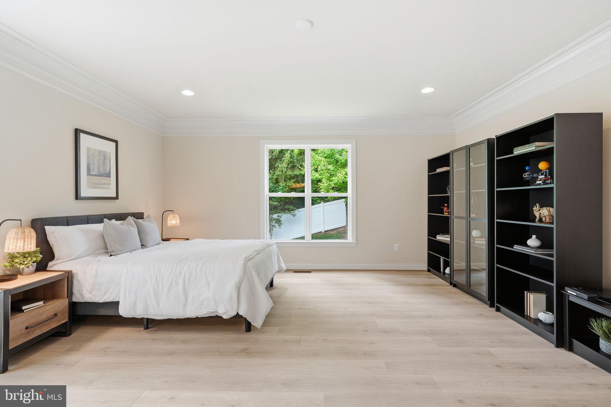 7821 Old Falls Road McLean, VA 22102 - Photo 21 of 62 a bedroom with a large bed and a window