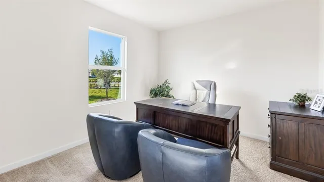 a living room with furniture and window