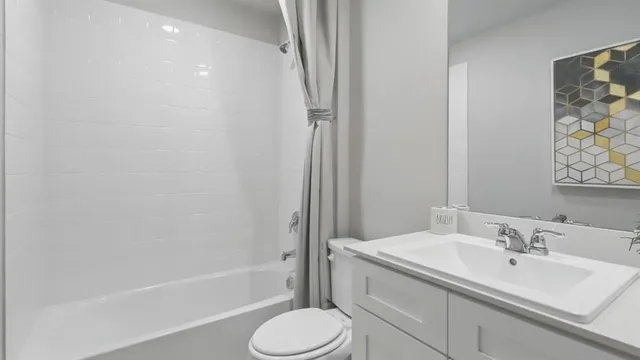 a bathroom with a shower and a toilet