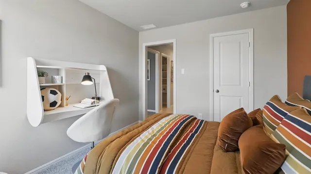 a bedroom with bed and a couch