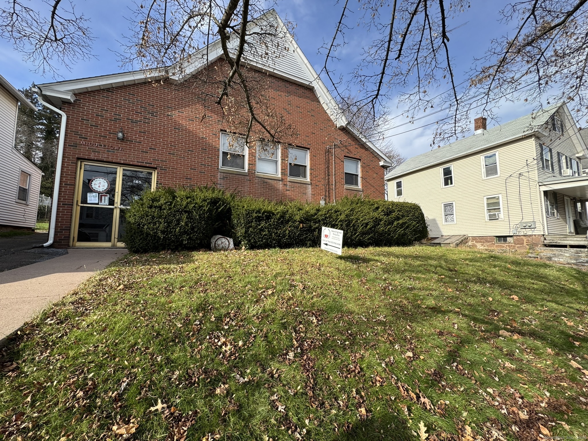 565 High Street Middletown, CT 06457 - Photo 1 of 24 a front view of a house with a yard