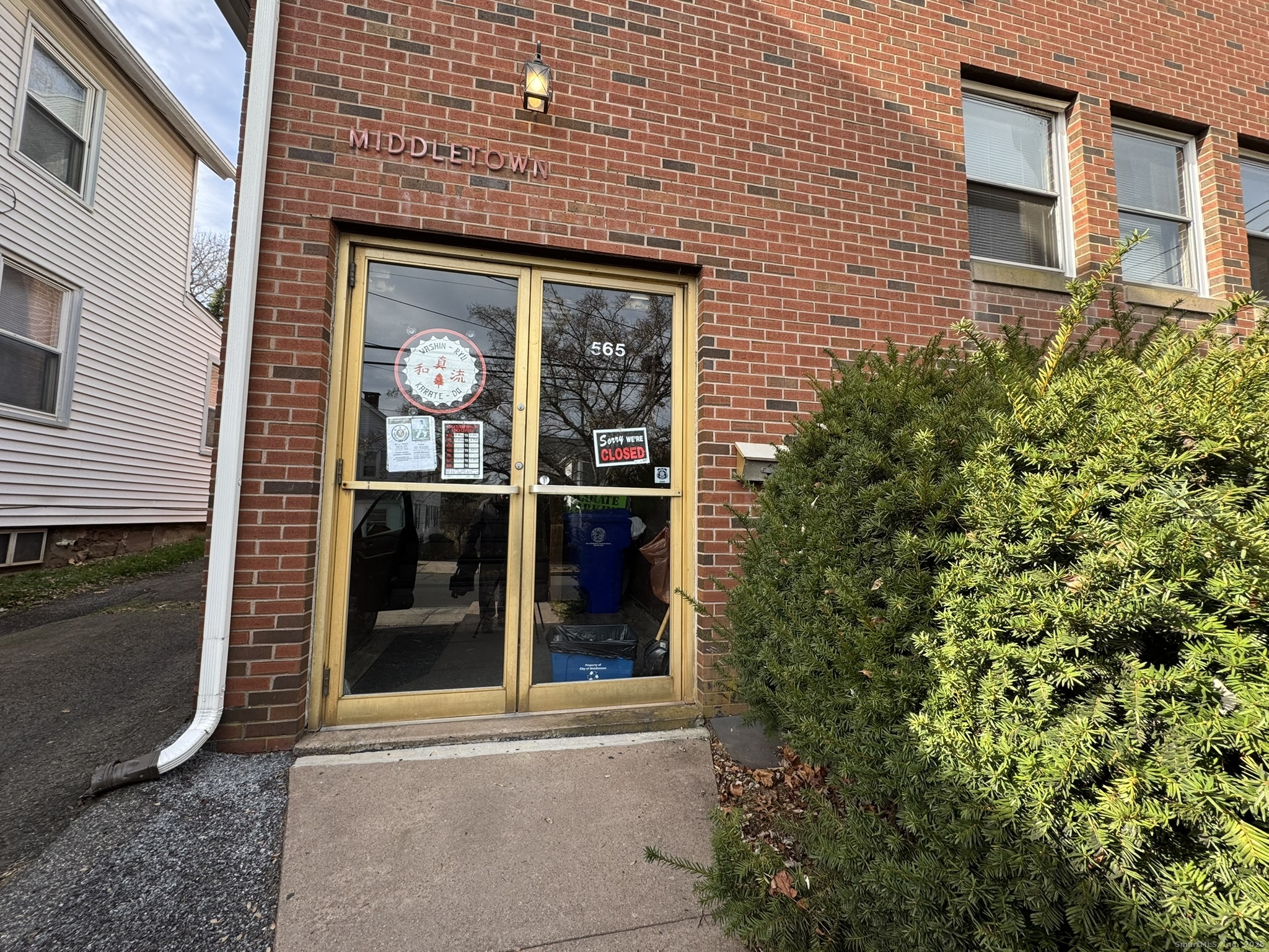 565 High Street Middletown, CT 06457 - Photo 3 of 24 a view of a brick house with a large windows