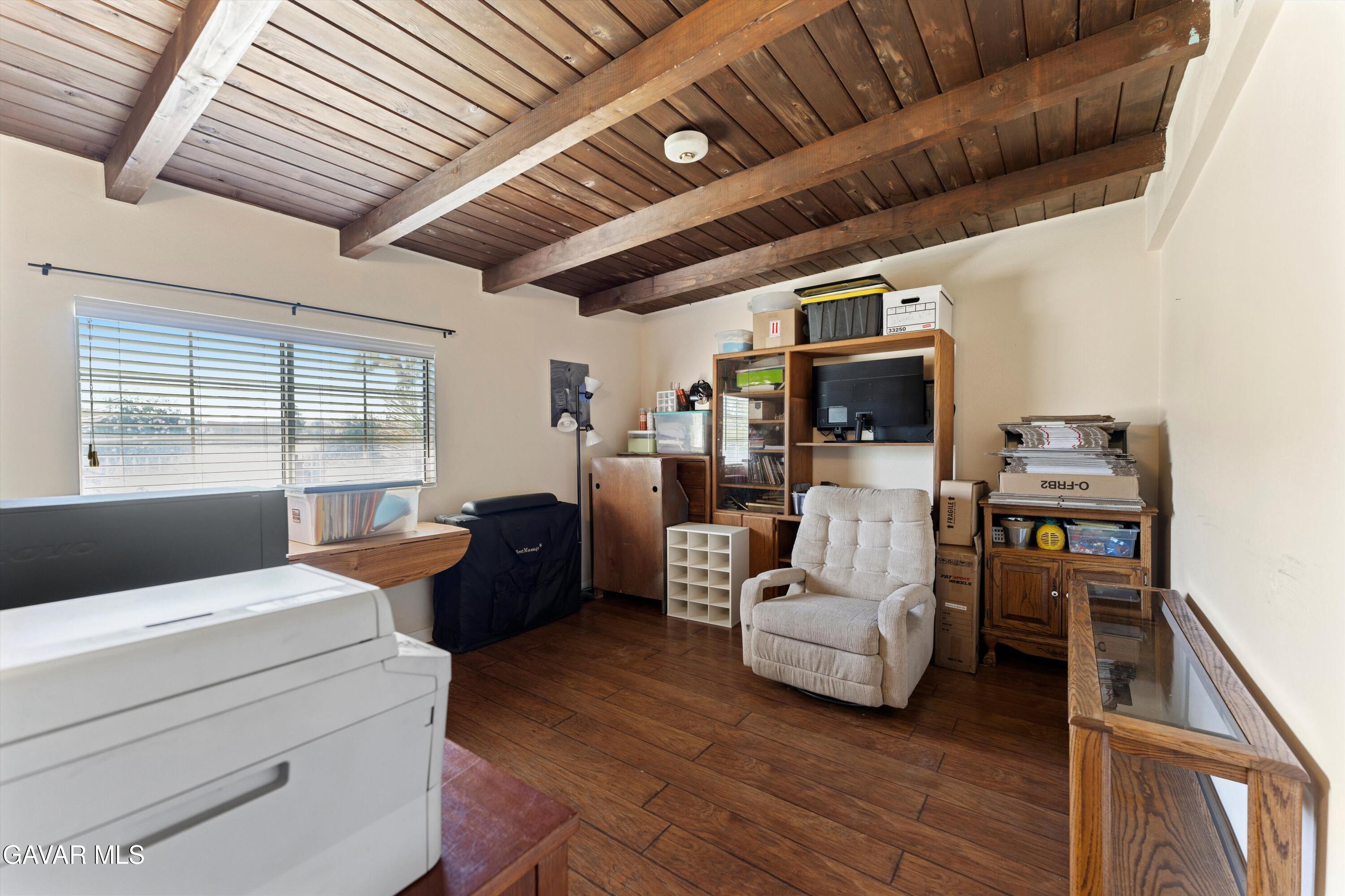 42409 12th Street West Lancaster, CA 93534 - Photo 14 of 20 a living room with furniture flat screen tv and a large window