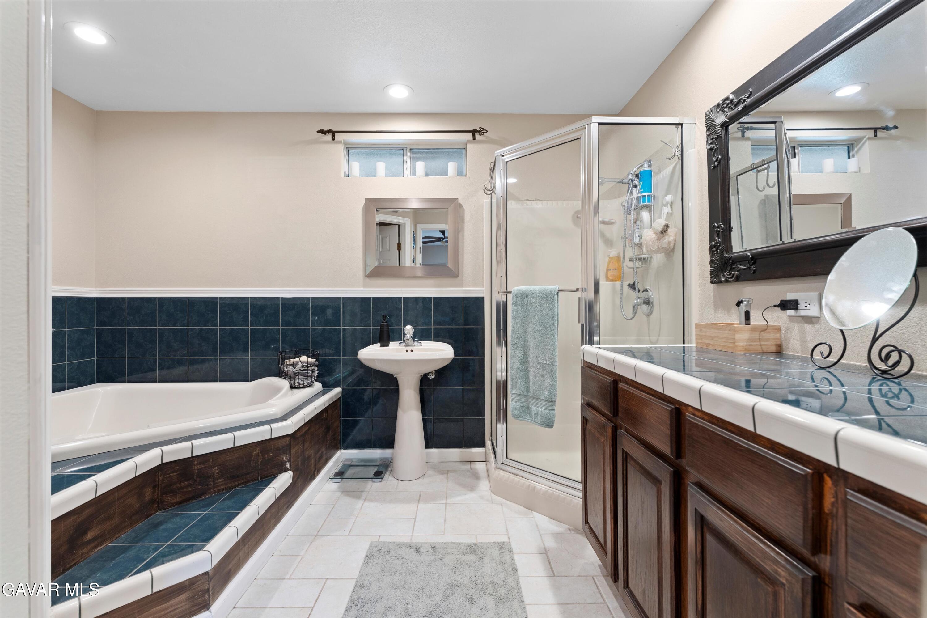 42409 12th Street West Lancaster, CA 93534 - Photo 17 of 20 a bathroom with a sink and a bathtub