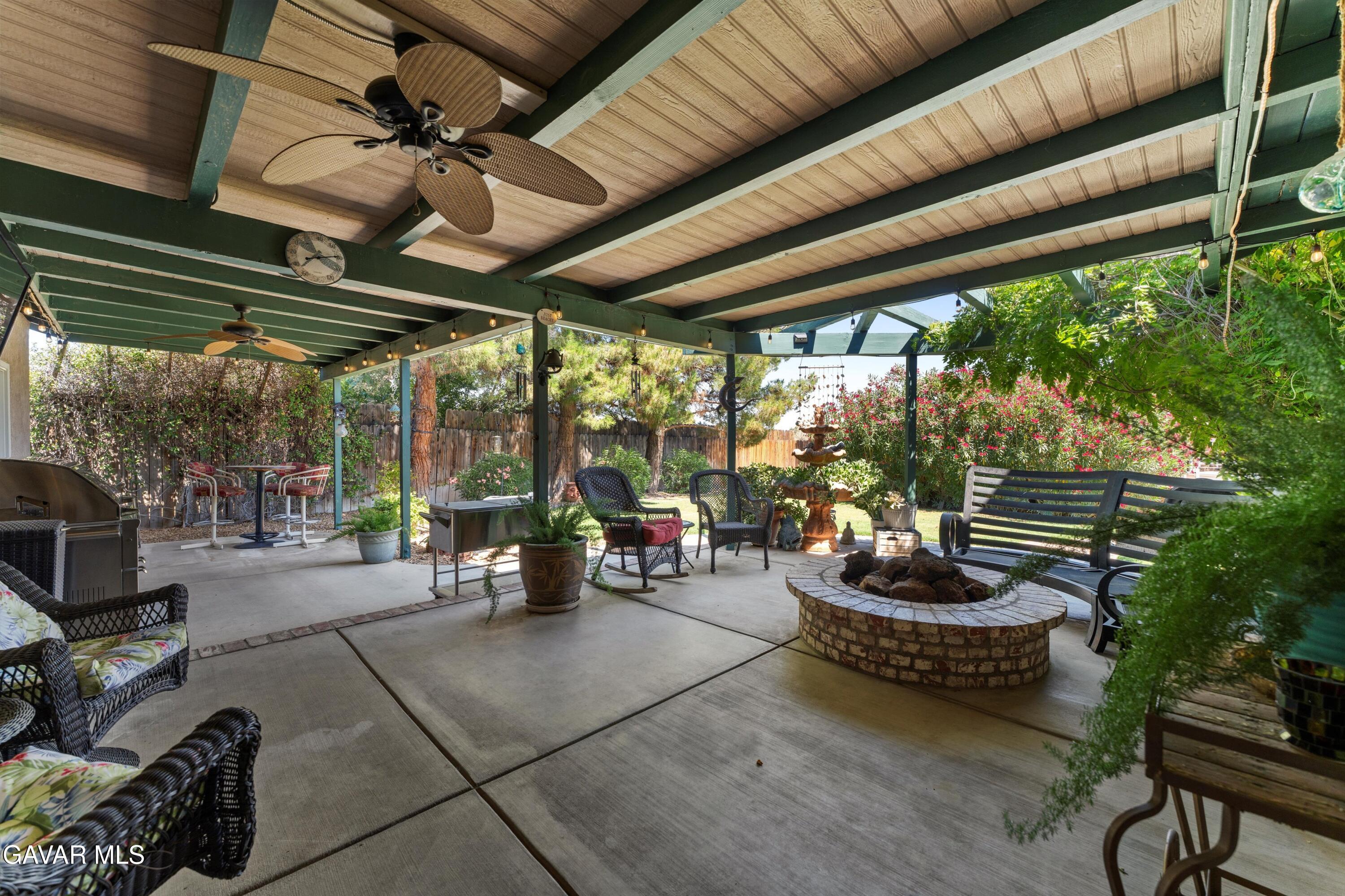 42409 12th Street West Lancaster, CA 93534 - Photo 19 of 20 a room with lots of potted plants and a large window