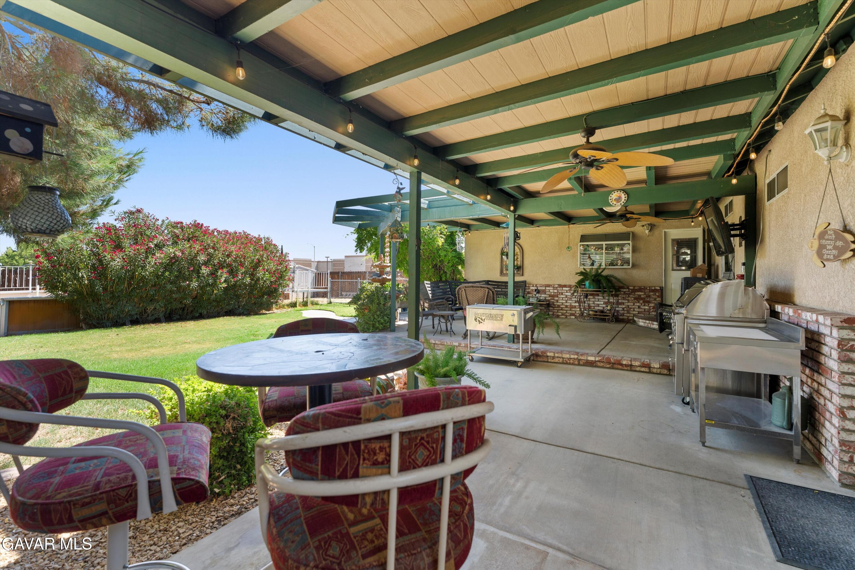 42409 12th Street West Lancaster, CA 93534 - Photo 20 of 20 a view of a chairs and table in backyard