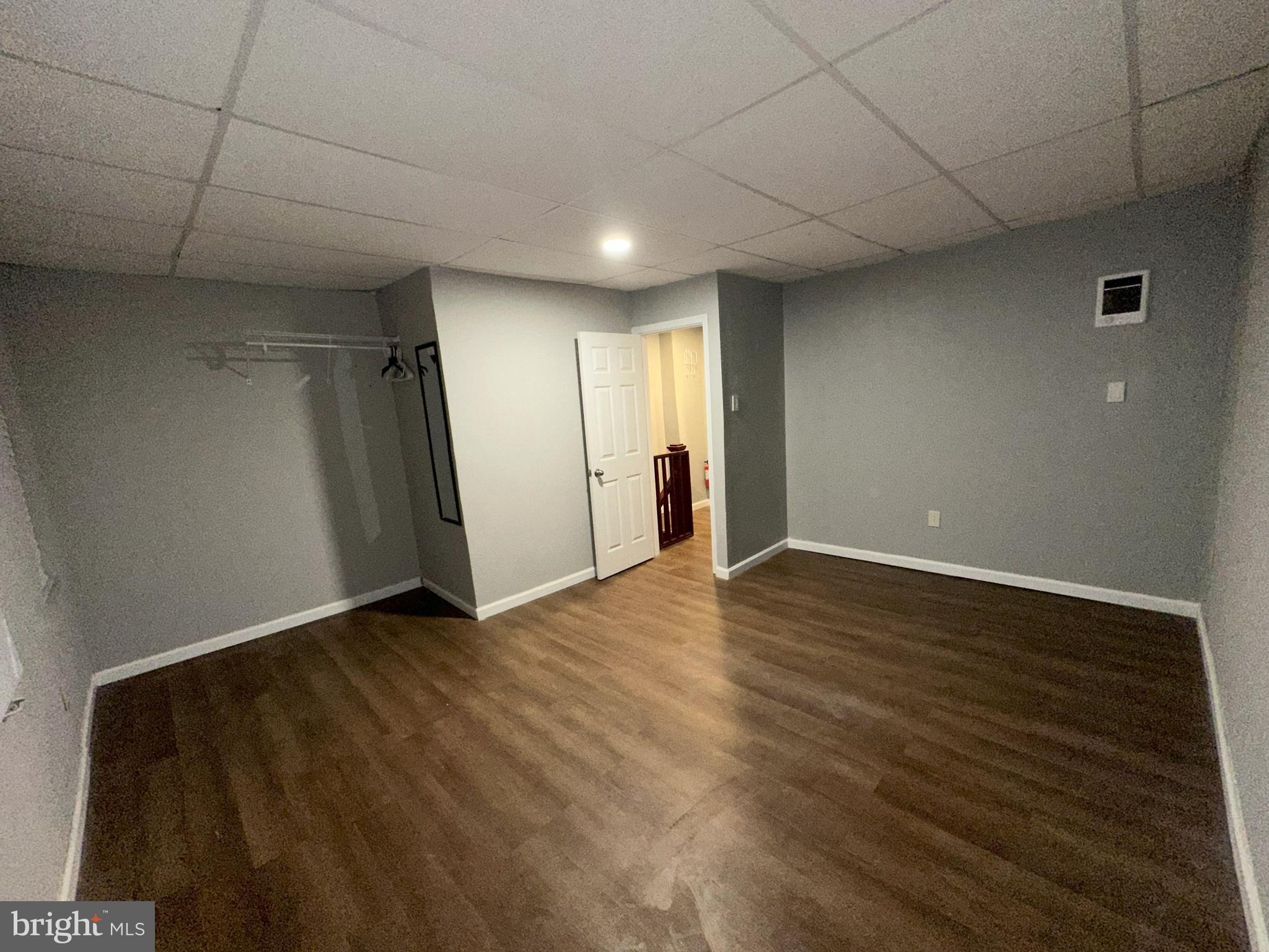 1510 Sycamore Street Curtis Bay, MD 21226 - Photo 16 of 23 a view of an empty room with wooden floor and a window