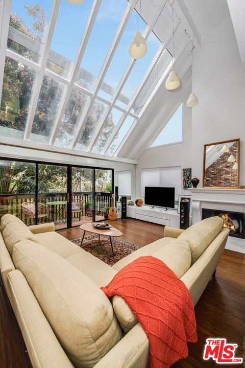 33 Reef Street, Unit 4 Marina del Rey, CA 90292 - Photo 2 of 28 a living room with furniture and a floor to ceiling window