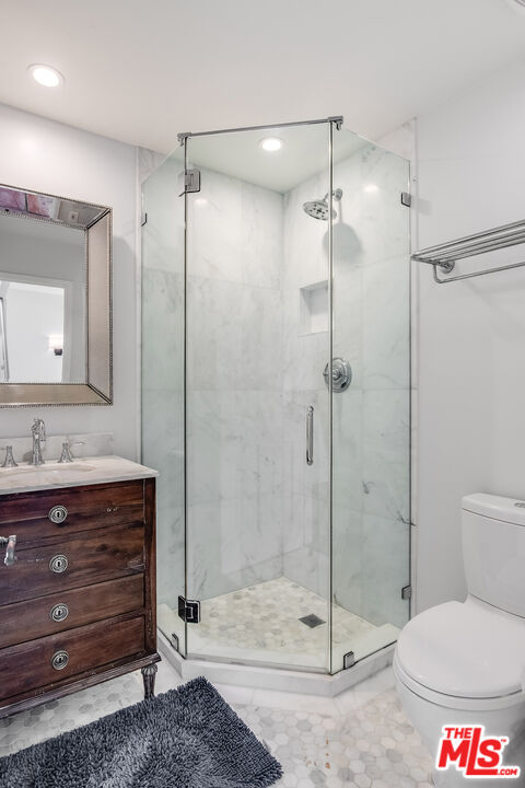 33 Reef Street, Unit 4 Marina del Rey, CA 90292 - Photo 23 of 28 a bathroom with a toilet sink and shower