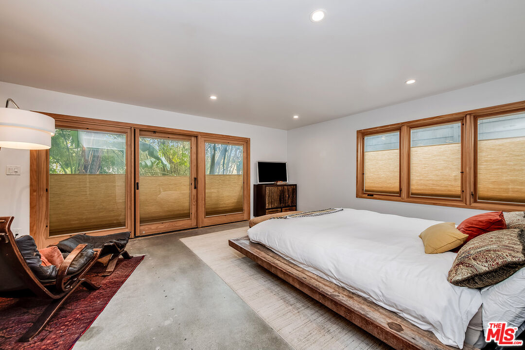 33 Reef Street, Unit 4 Marina del Rey, CA 90292 - Photo 7 of 28 a bedroom with a bed and glass door