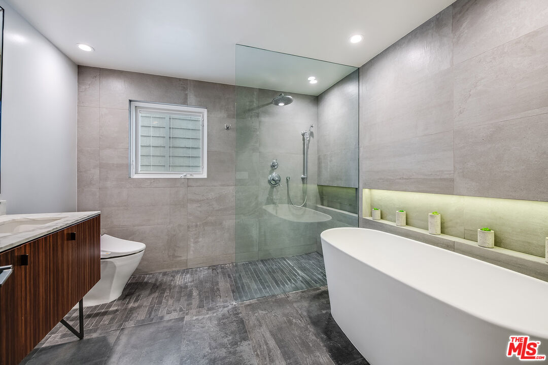 33 Reef Street, Unit 4 Marina del Rey, CA 90292 - Photo 8 of 28 a bathroom with a large tub a toilet a sink and view