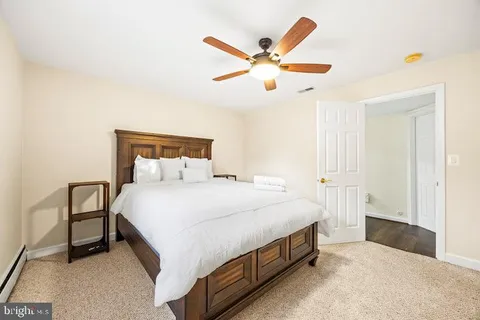 a large white bed in a white room