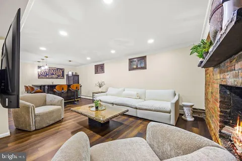 a view of a dining room with furniture and a mirror