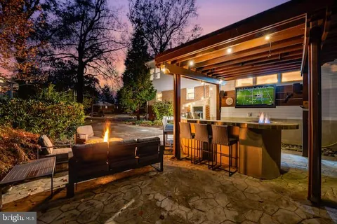a view of a balcony with a floor to ceiling window and wooden floor