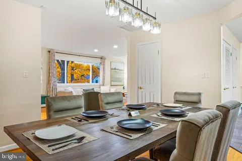 a workspace with furniture and chandelier