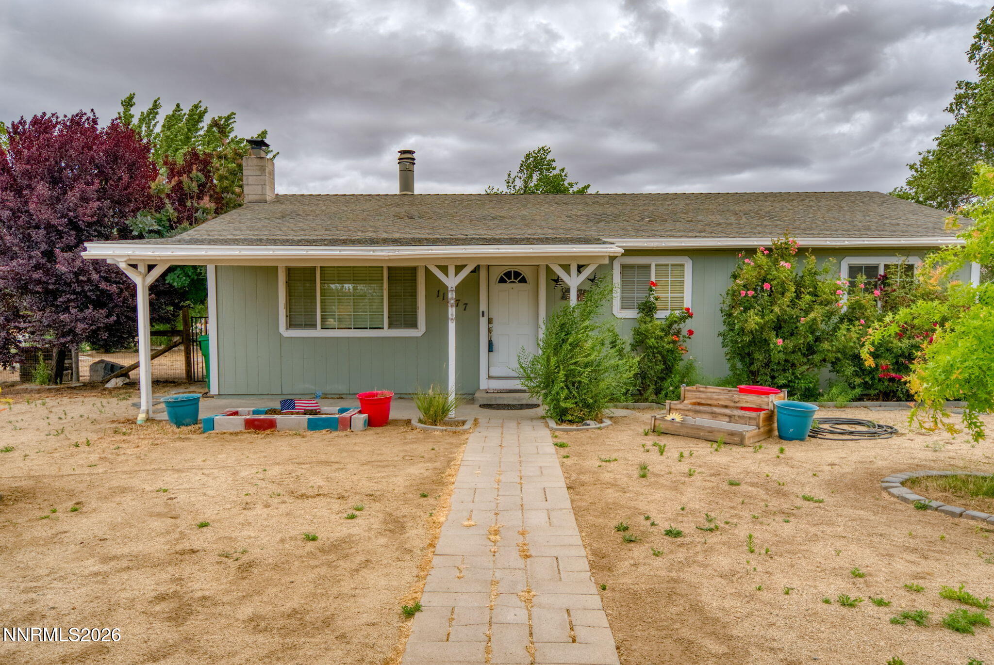 11577 Deodar Way Reno, NV 89506 - Photo 30 of 58 a front view of a house with a yard