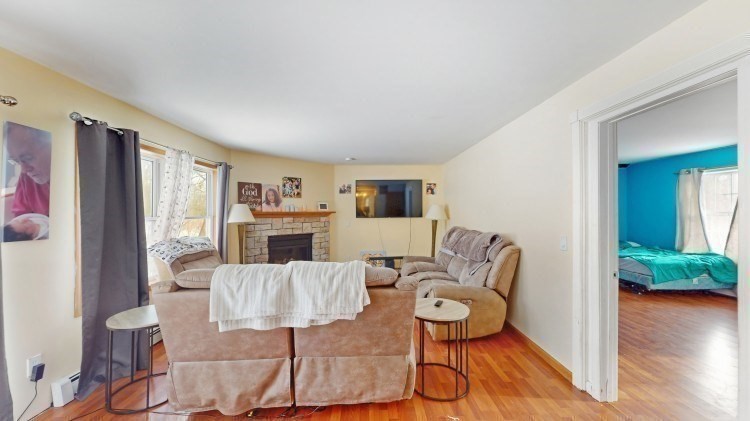 15 Teddy Road Worcester, MA 01603 - Photo 10 of 26 a living room with furniture a large window and wooden floor
