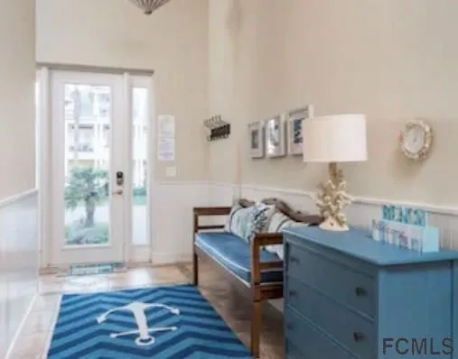 a bedroom with a large bed and a large window
